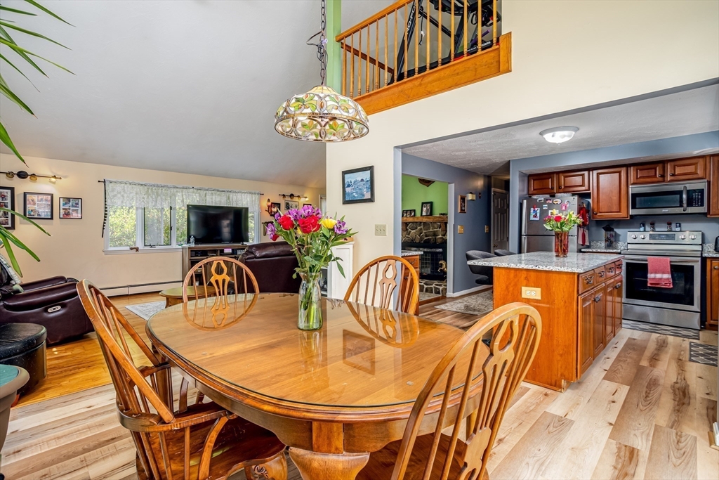 188 Hubbardston Road Templeton, MA 01468 - Photo 4 of 33 a dining room filled chandelier and wooden floor