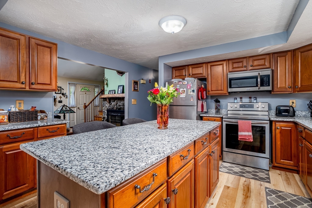 188 Hubbardston Road Templeton, MA 01468 - Photo 5 of 33 a kitchen with stainless steel appliances granite countertop a sink stove and refrigerator