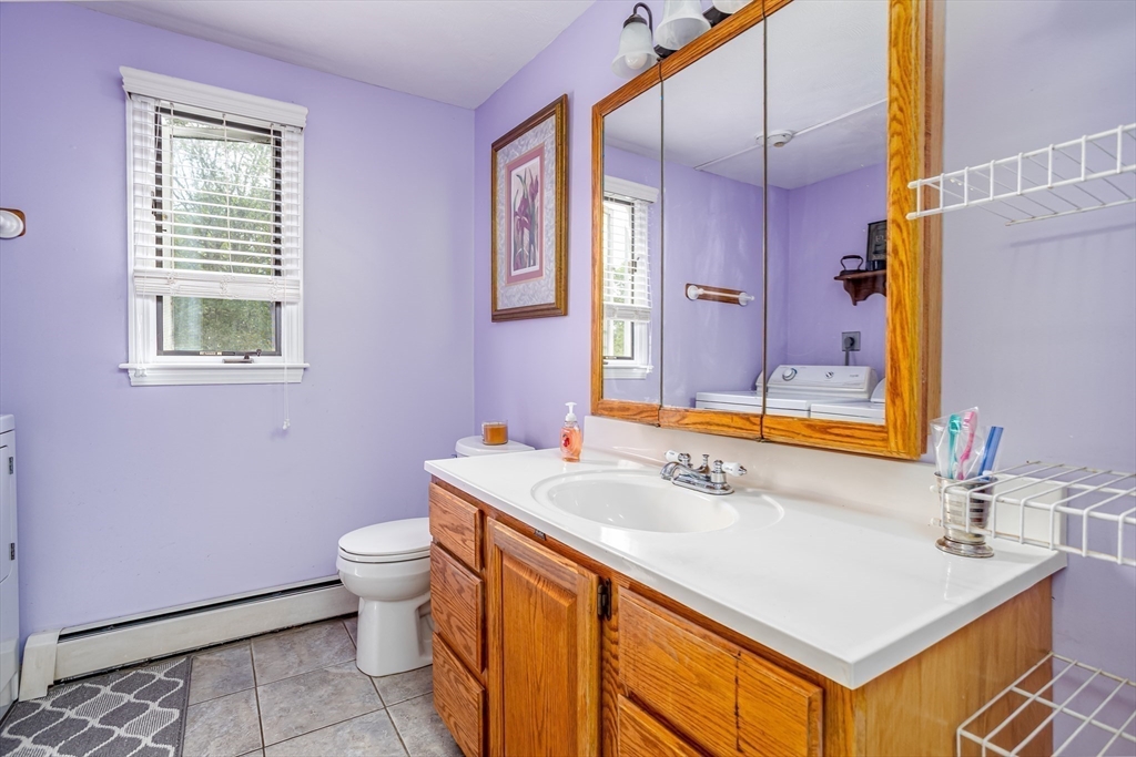 188 Hubbardston Road Templeton, MA 01468 - Photo 9 of 33 a bathroom with a sink a toilet a mirror and vanity