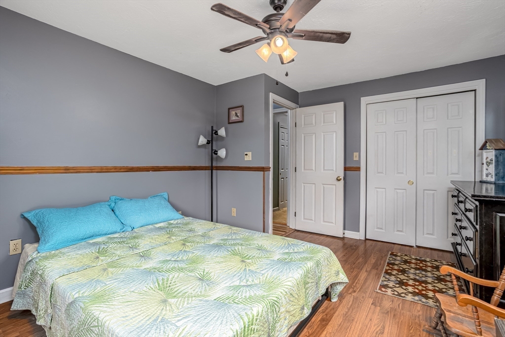 188 Hubbardston Road Templeton, MA 01468 - Photo 10 of 33 a bedroom with a bed and a chandelier