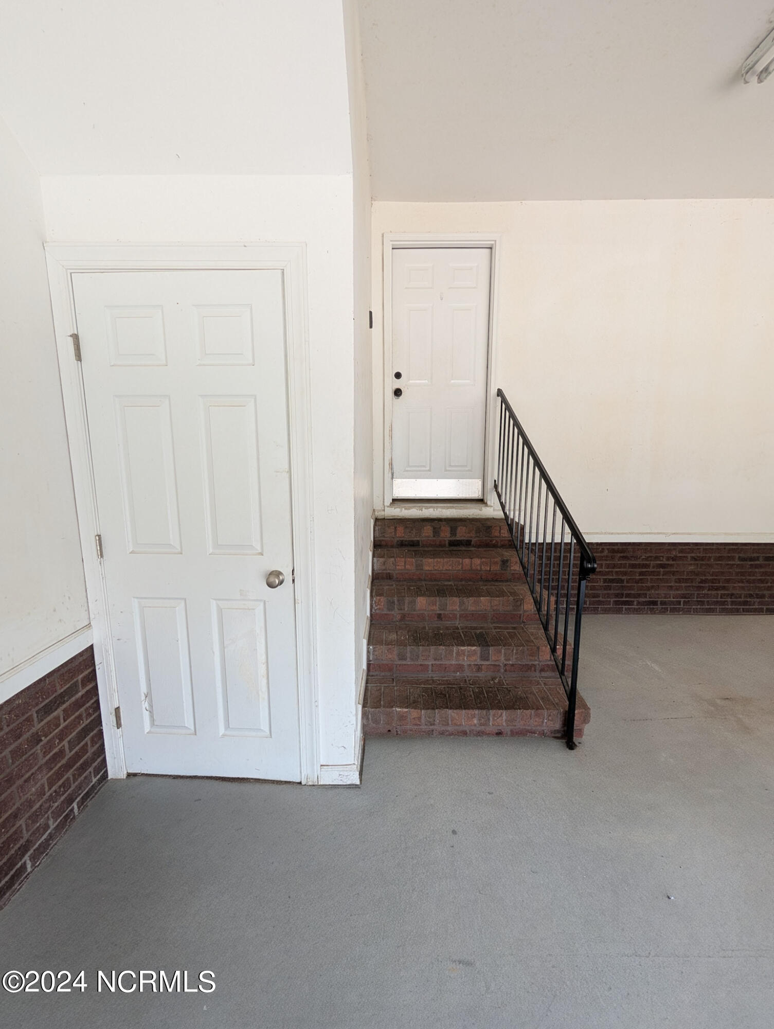 856 Nor-Am Road Pikeville, NC 27863 - Photo 103 of 107 water heater storage and entrance into home from garage
