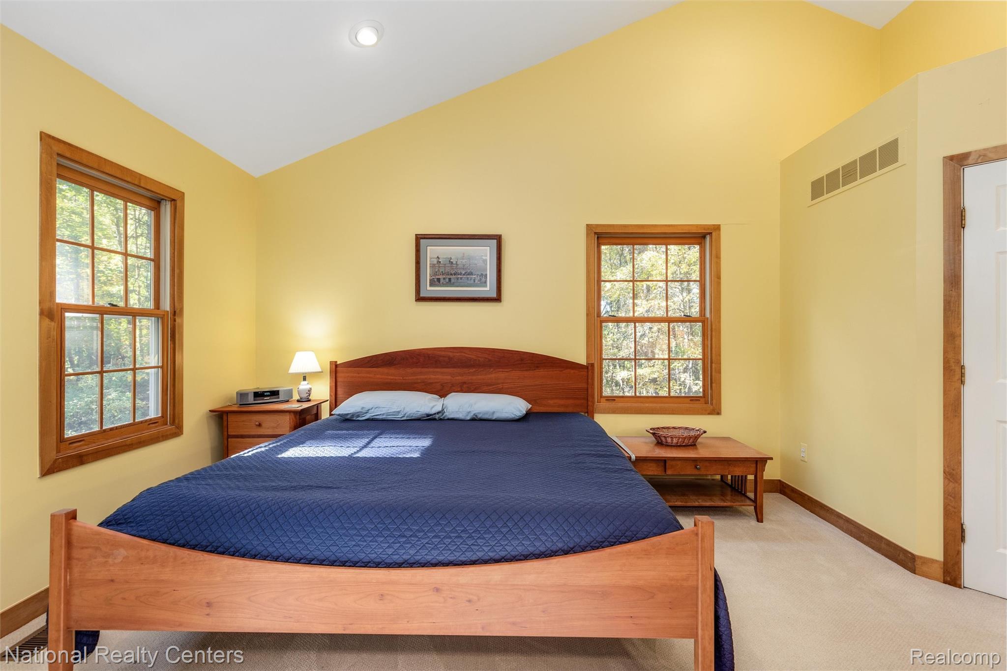 2322 Addaleen Road Highland, MI 48357 - Photo 32 of 54 Bedroom with vaulted ceiling, light carpet, and recessed lighting