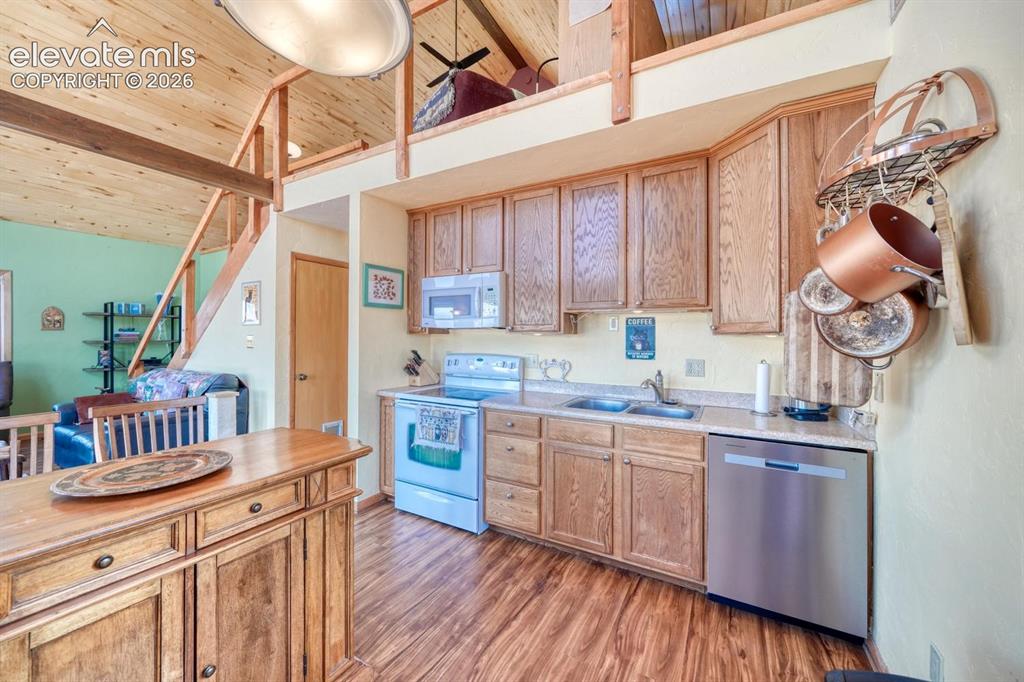 489 Excelsior Road Westcliffe, CO 81252 - Photo 10 of 34 a kitchen with cabinets a sink and appliances