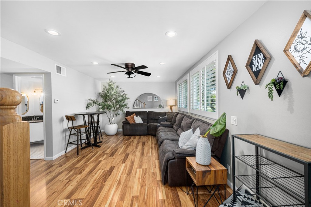 4237 Larwin Avenue Cypress, CA 90630 - Photo 8 of 48 a living room with furniture and a wooden floor