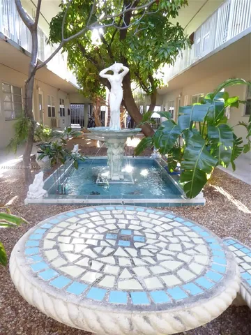 a view of a yard with a fountain