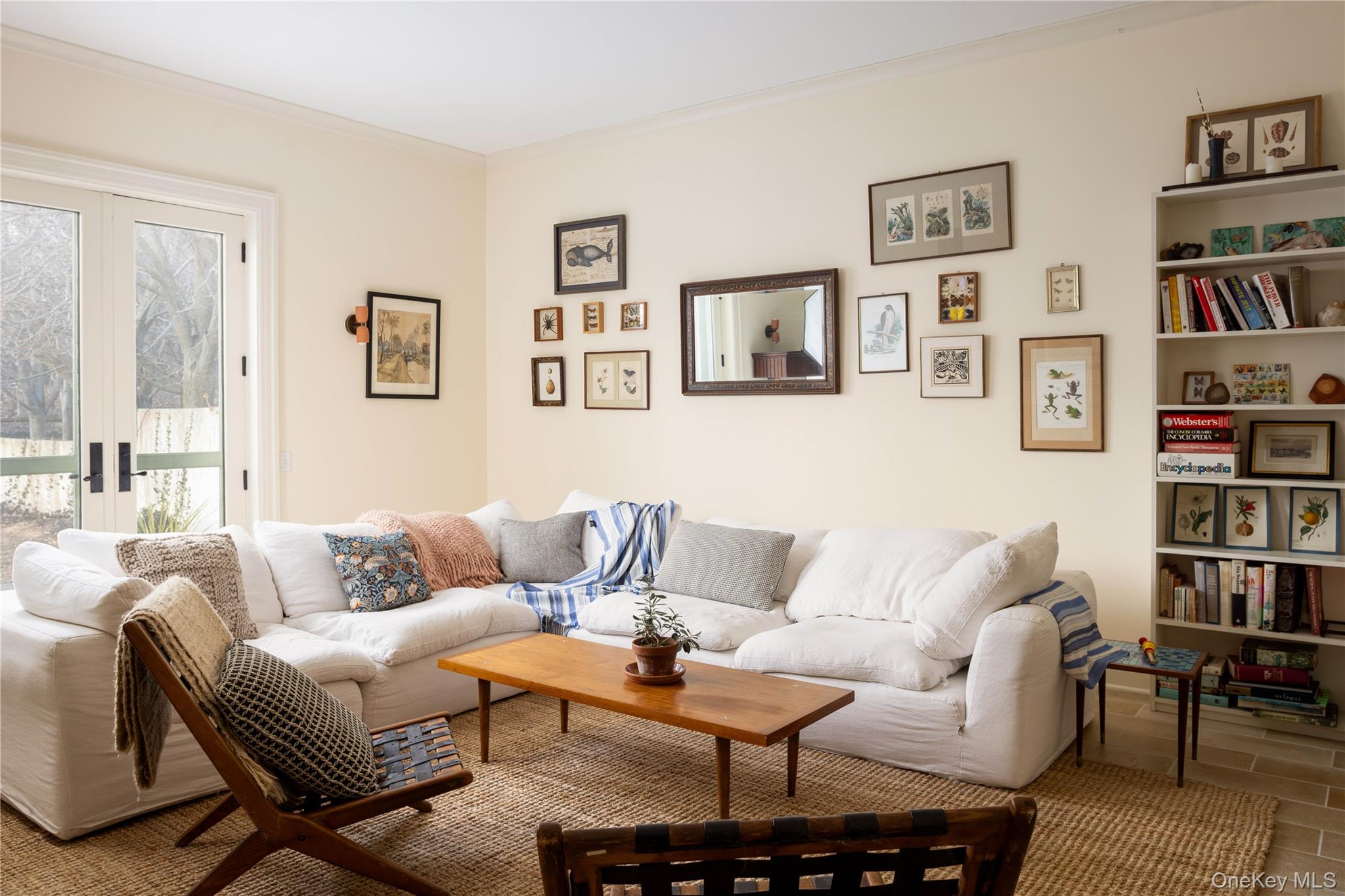 2840 Stars Road East Marion, NY 11939 - Photo 16 of 43 a living room with furniture and a book shelf