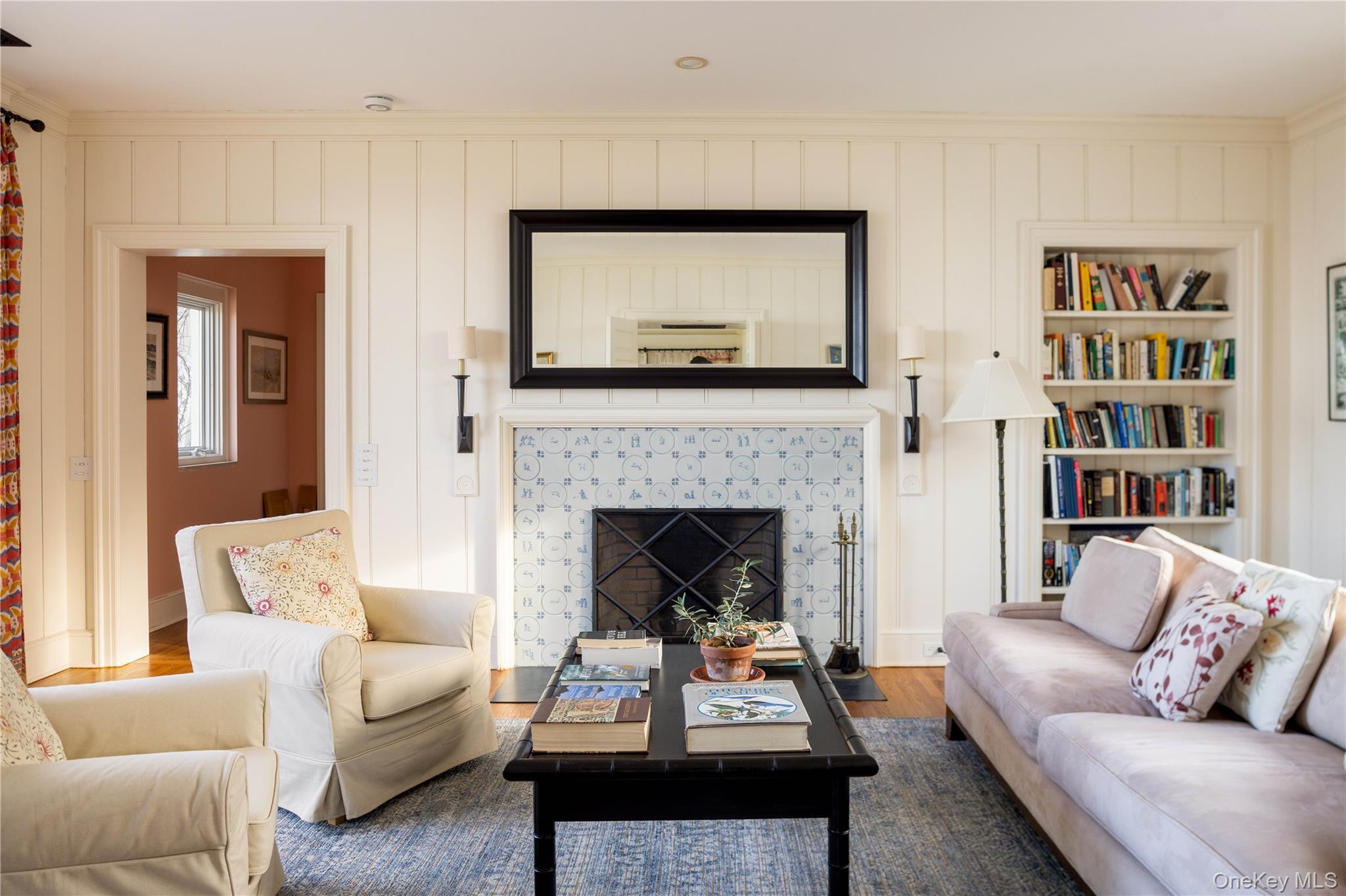 2840 Stars Road East Marion, NY 11939 - Photo 17 of 43 a living room with furniture and a fireplace