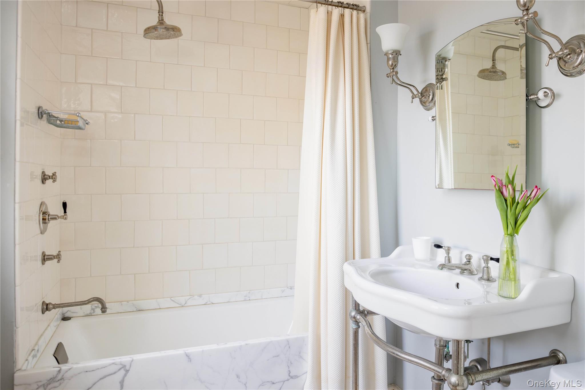 2840 Stars Road East Marion, NY 11939 - Photo 28 of 43 a bathroom with a sink and a mirror