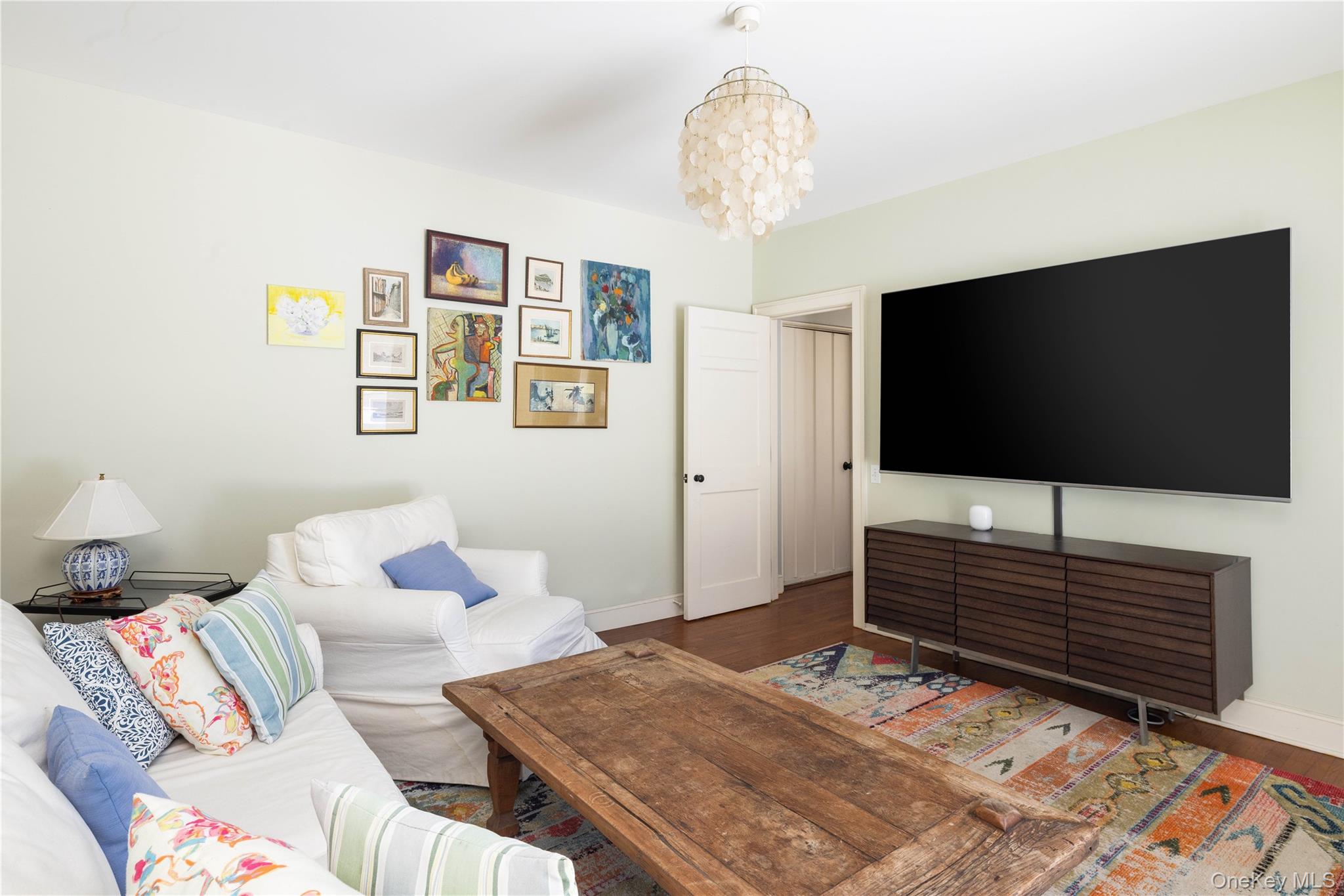 2840 Stars Road East Marion, NY 11939 - Photo 32 of 43 a bedroom with a bed and a flat screen tv