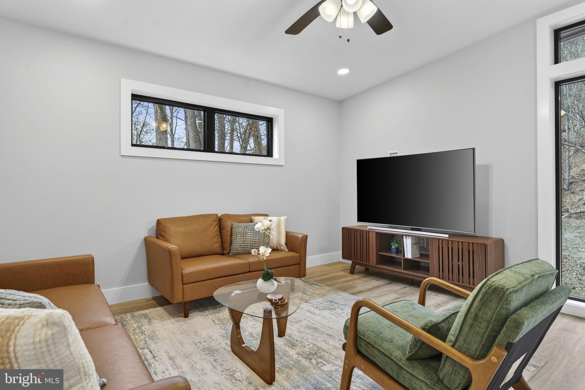 1956 Dove Hollow Road Mathias, WV 26812 - Photo 16 of 113 a living room with furniture and a flat screen tv