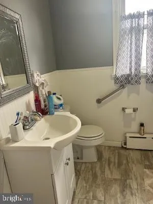 a bathroom with a sink and a toilet