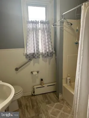 a bathroom with a sink and a shower