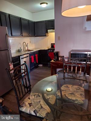 914 Ellsworth Street Philadelphia, PA 19147 - Photo 2 of 14 a living room with furniture and a flat screen tv