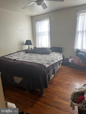 914 Ellsworth Street Philadelphia, PA 19147 - Photo 7 of 14 a bedroom with a bed and wooden floor