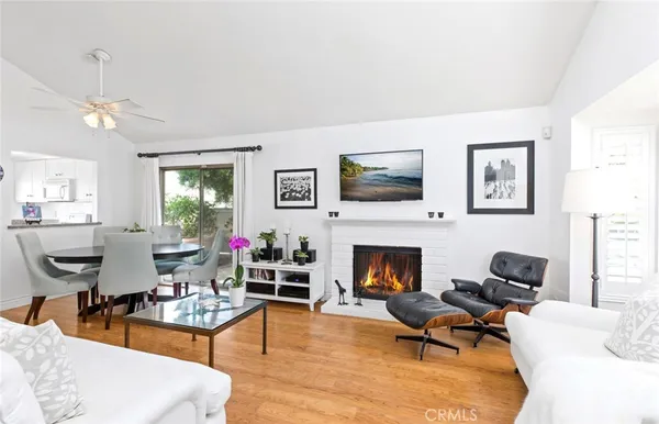 a living room with furniture flat screen tv and a fireplace