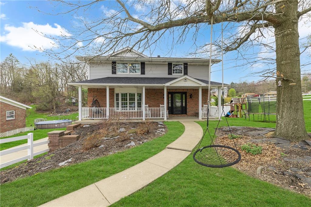 100 Roosevelt Drive Monaca, PA 15061 - Photo 1 of 39 a view of a house with a yard