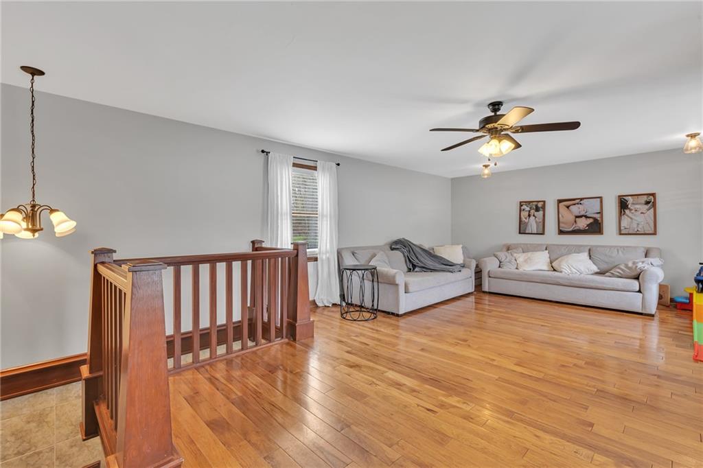 100 Roosevelt Drive Monaca, PA 15061 - Photo 13 of 39 a living room with furniture and a chandelier