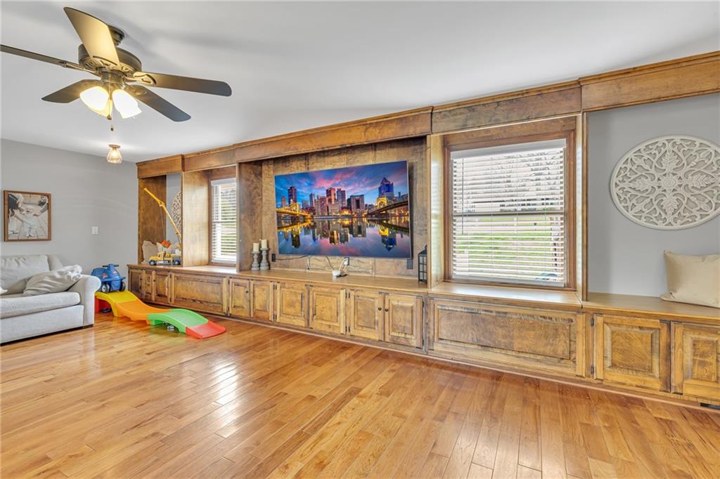 100 Roosevelt Drive Monaca, PA 15061 - Photo 14 of 39 a living room with furniture floor to ceiling window and a wooden floor
