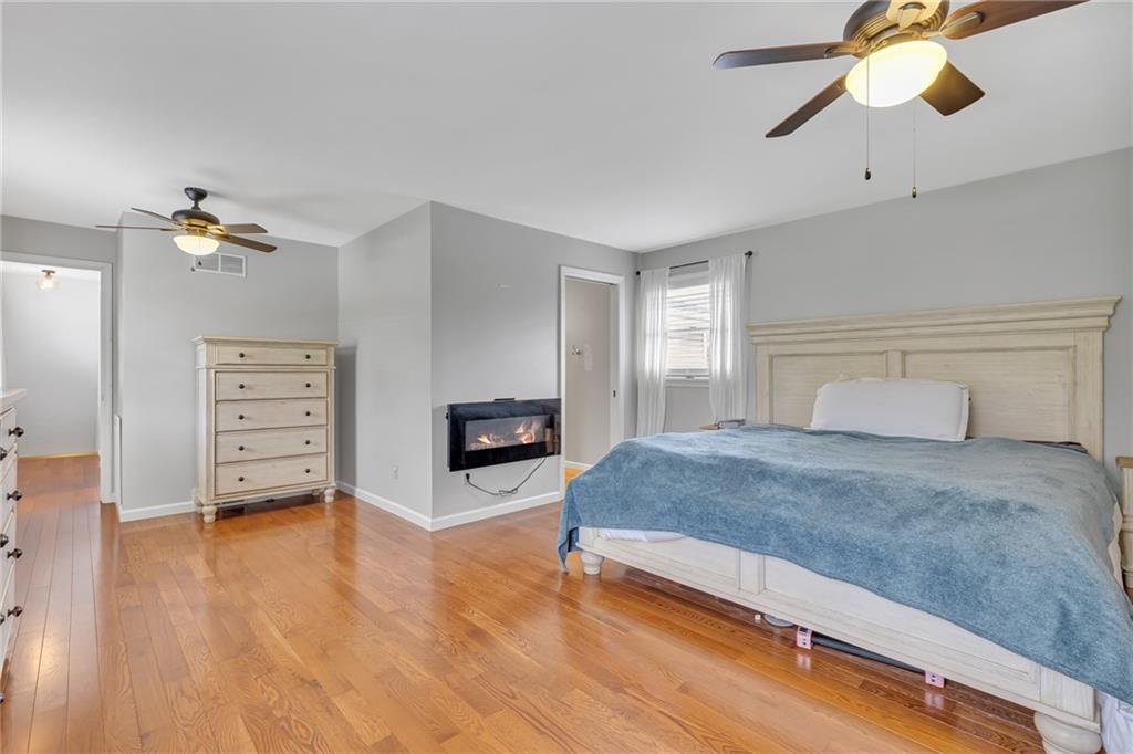 100 Roosevelt Drive Monaca, PA 15061 - Photo 18 of 39 a spacious bedroom with a bed and wooden floor