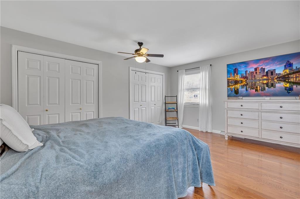 100 Roosevelt Drive Monaca, PA 15061 - Photo 19 of 39 a spacious bedroom with a bed and a cabinets