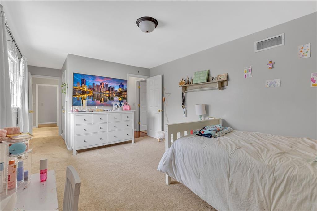 100 Roosevelt Drive Monaca, PA 15061 - Photo 21 of 39 a bedroom with a bed and a television