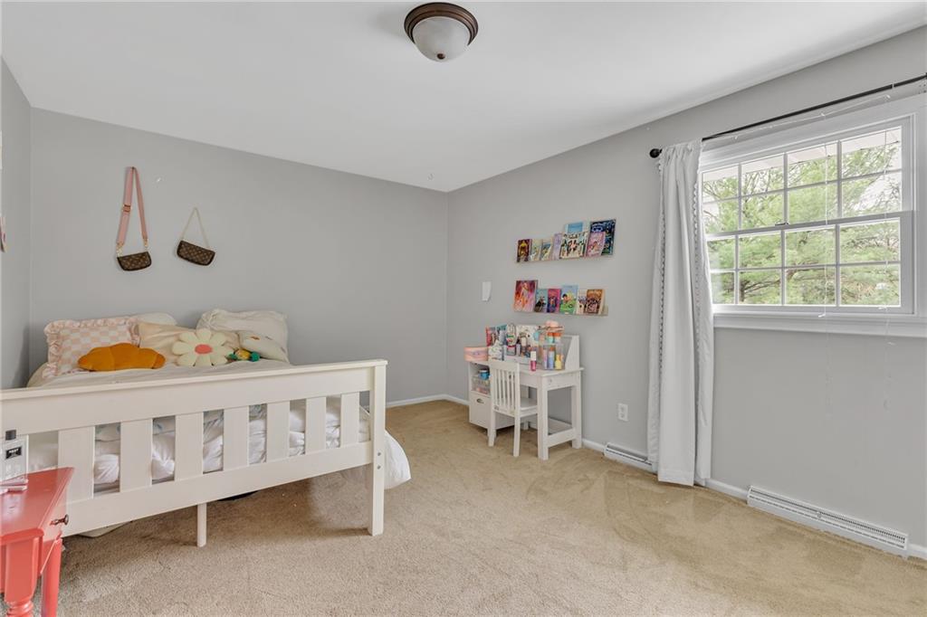 100 Roosevelt Drive Monaca, PA 15061 - Photo 22 of 39 a bedroom with furniture a baby crib and a window