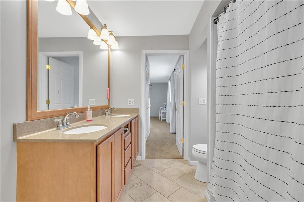 100 Roosevelt Drive Monaca, PA 15061 - Photo 23 of 39 a bathroom with a sink and a mirror