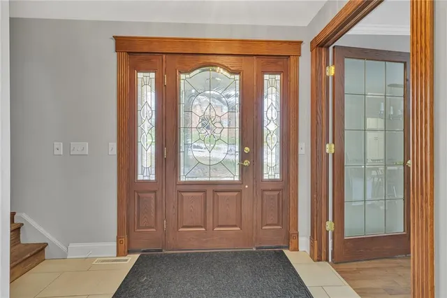 a view of front door with a mirror