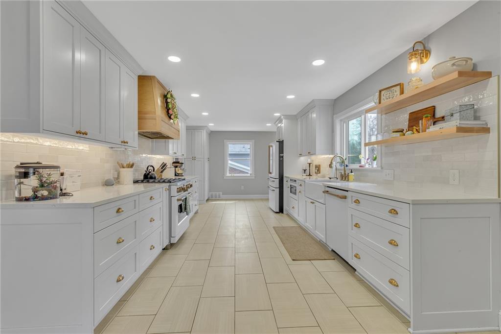 100 Roosevelt Drive Monaca, PA 15061 - Photo 6 of 39 a large kitchen with stainless steel appliances lots of counter space and wooden floor