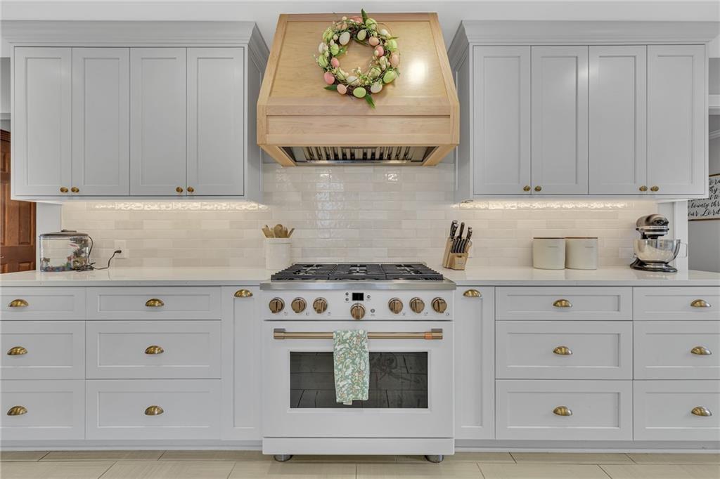 100 Roosevelt Drive Monaca, PA 15061 - Photo 7 of 39 a stove top oven sitting inside of a kitchen