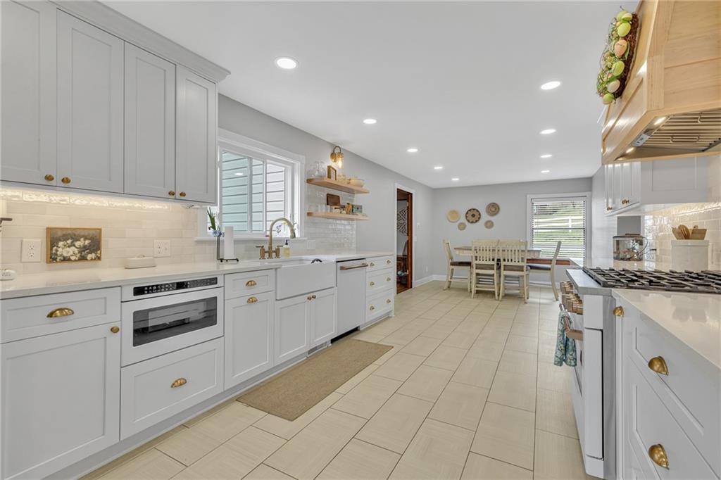 100 Roosevelt Drive Monaca, PA 15061 - Photo 10 of 39 a kitchen with white cabinets stainless steel appliances and sink