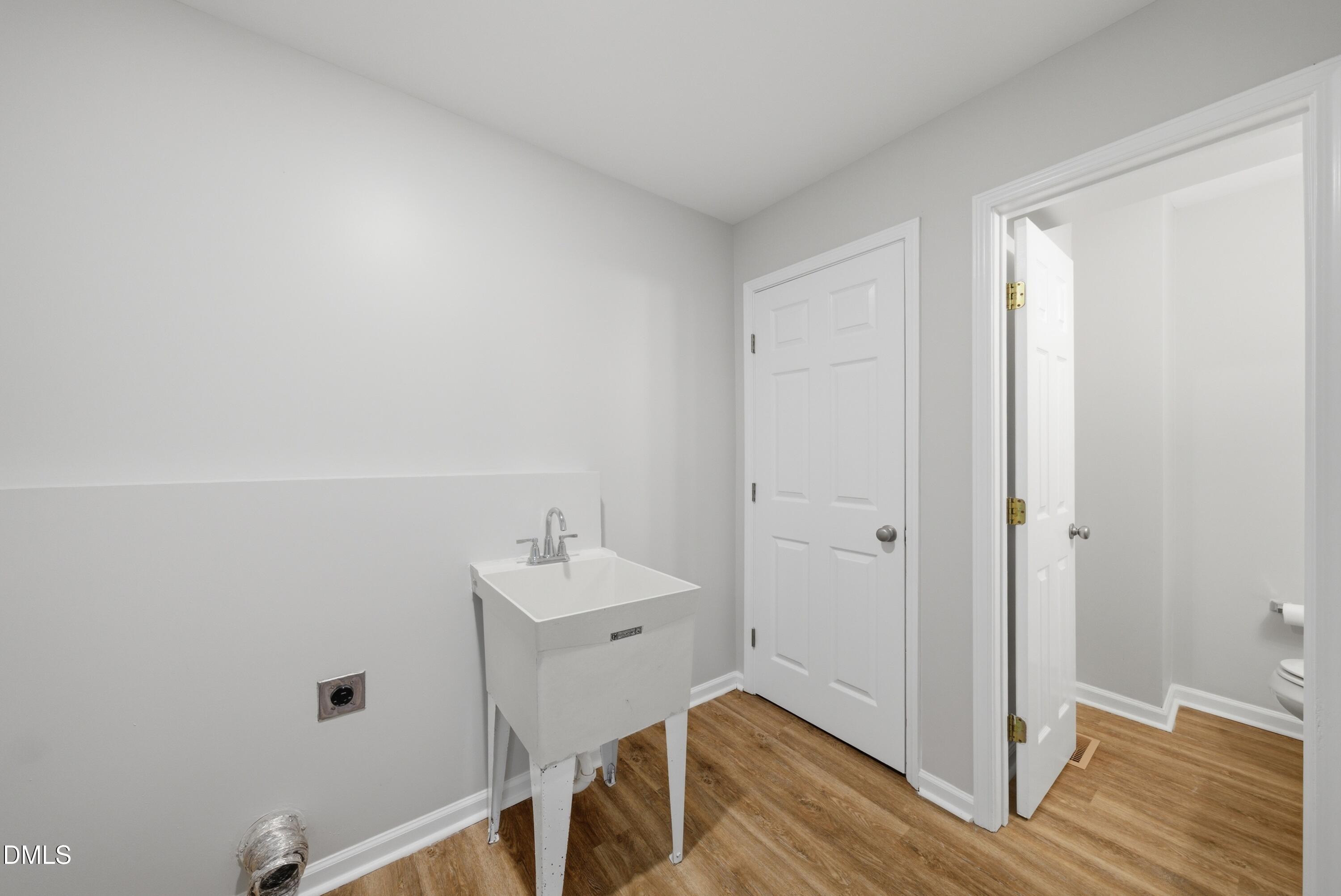 201 Tonylee Court, Unit A Raleigh, NC 27603 - Photo 19 of 30 a bathroom with a sink and a mirror