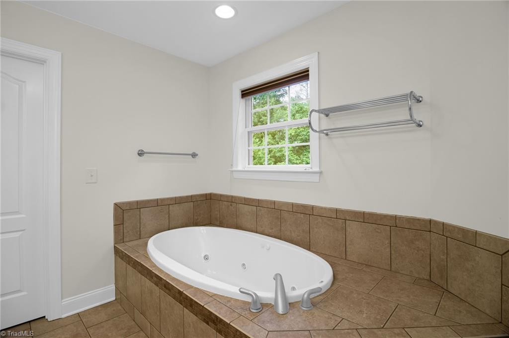 8916 Grove Park Drive Oak Ridge, NC 27310 - Photo 17 of 29 Primary bathroom jet tub (shower not shown)