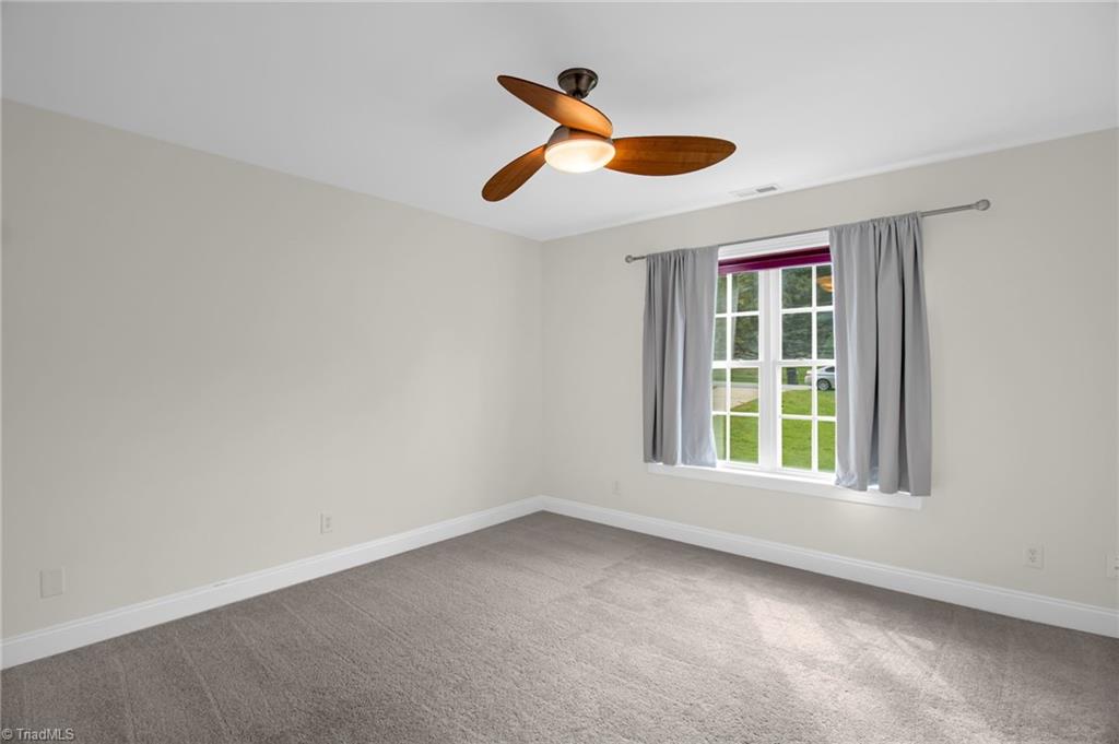 8916 Grove Park Drive Oak Ridge, NC 27310 - Photo 19 of 29 Bedroom 3