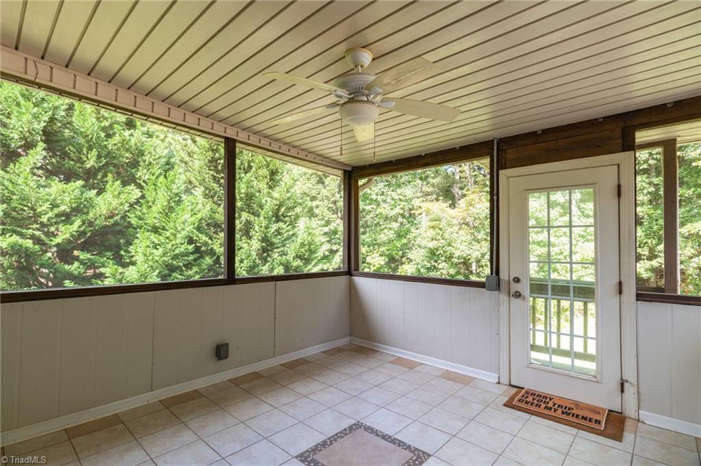 8916 Grove Park Drive Oak Ridge, NC 27310 - Photo 25 of 29 Screen porch partially enclosed