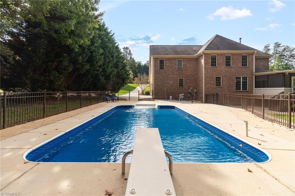 8916 Grove Park Drive Oak Ridge, NC 27310 - Photo 27 of 29 Pool, driveway