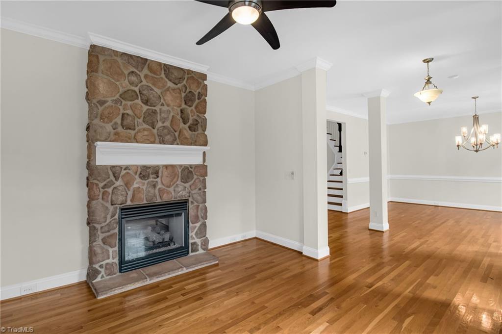 8916 Grove Park Drive Oak Ridge, NC 27310 - Photo 6 of 29 Living room with double sided fireplace