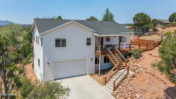 an aerial view of house with yard