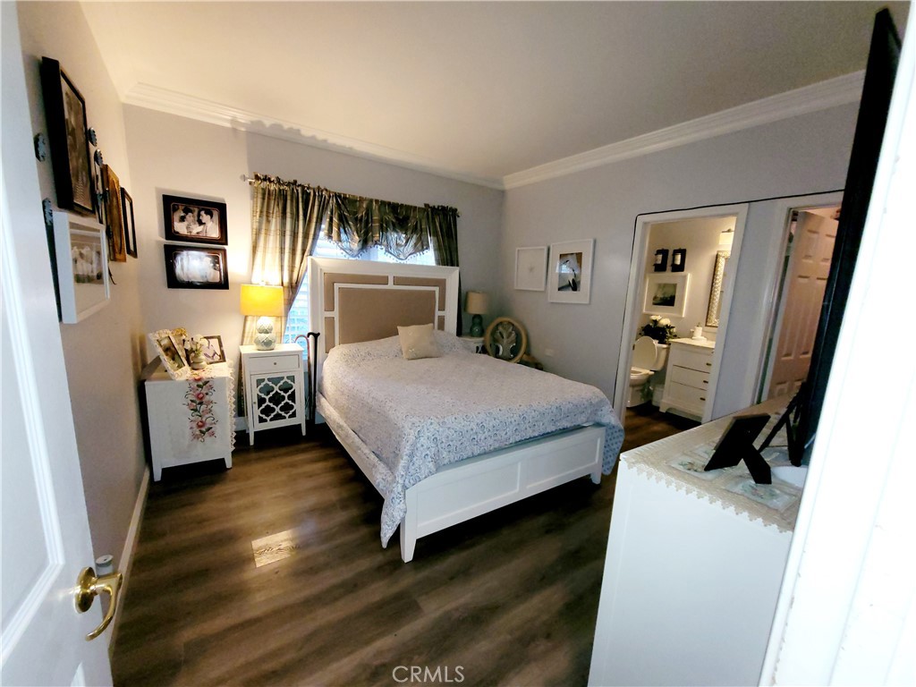 14119 Ashton Lane Riverside, CA 92508 - Photo 17 of 47 a bedroom with a bed and a flat tv screen on the dresser