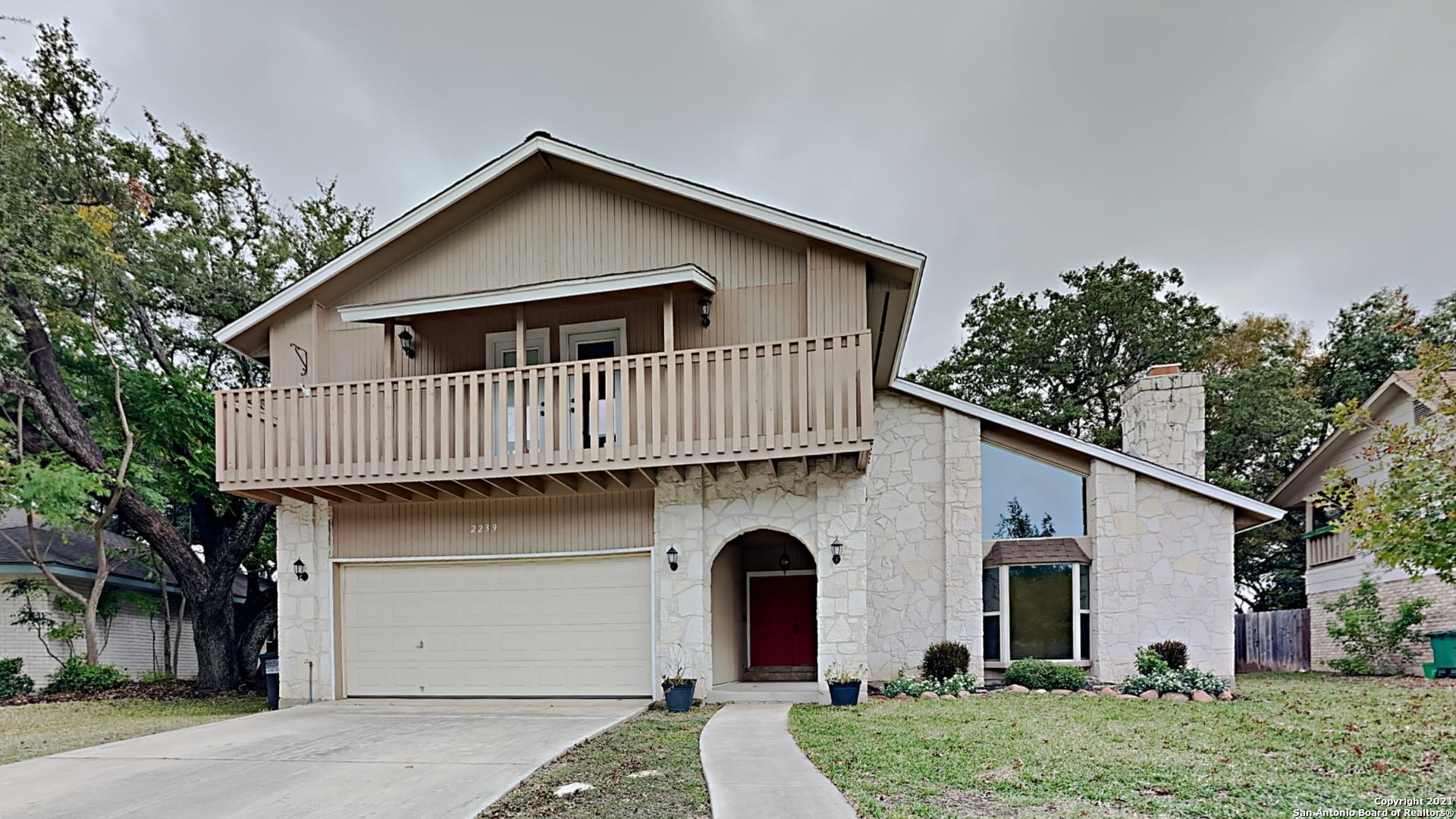 a front view of a house with garage