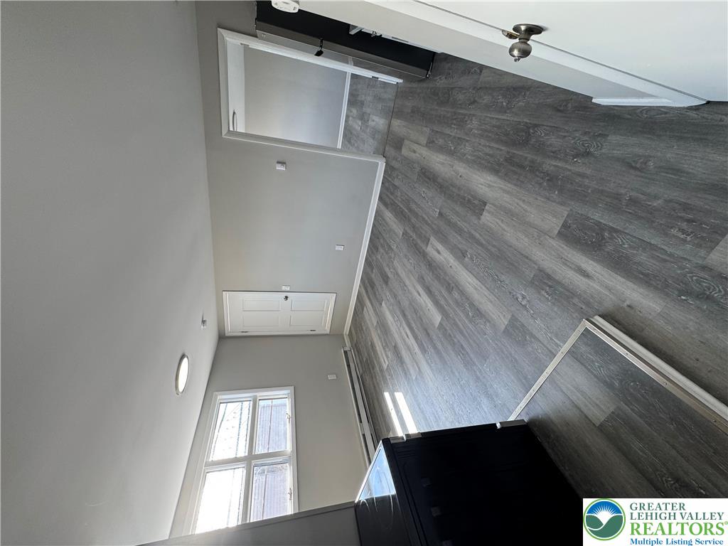 702 Walnut Street, Unit 2 Freeland, PA 18224 - Photo 2 of 8 Tall ceilings and light wood-look flooring enhance this flexible interior space.
