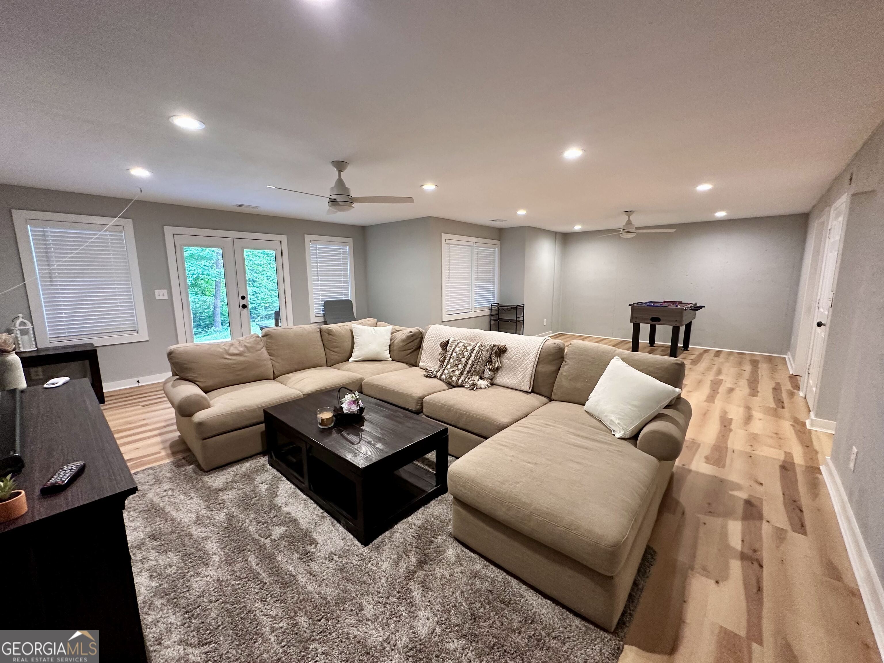 2769 Bean Creek Road Sautee Nacoochee, GA 30571 - Photo 20 of 33 a living room with furniture a ceiling fan and a rug