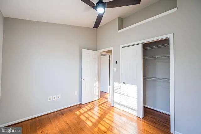 a view of an empty room and wooden floor