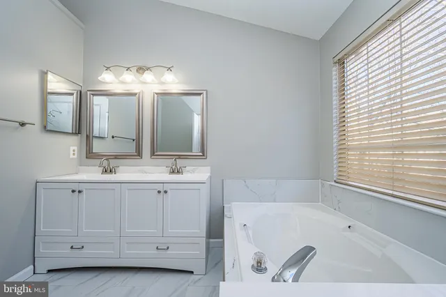 a bathroom with a sink and a bathtub