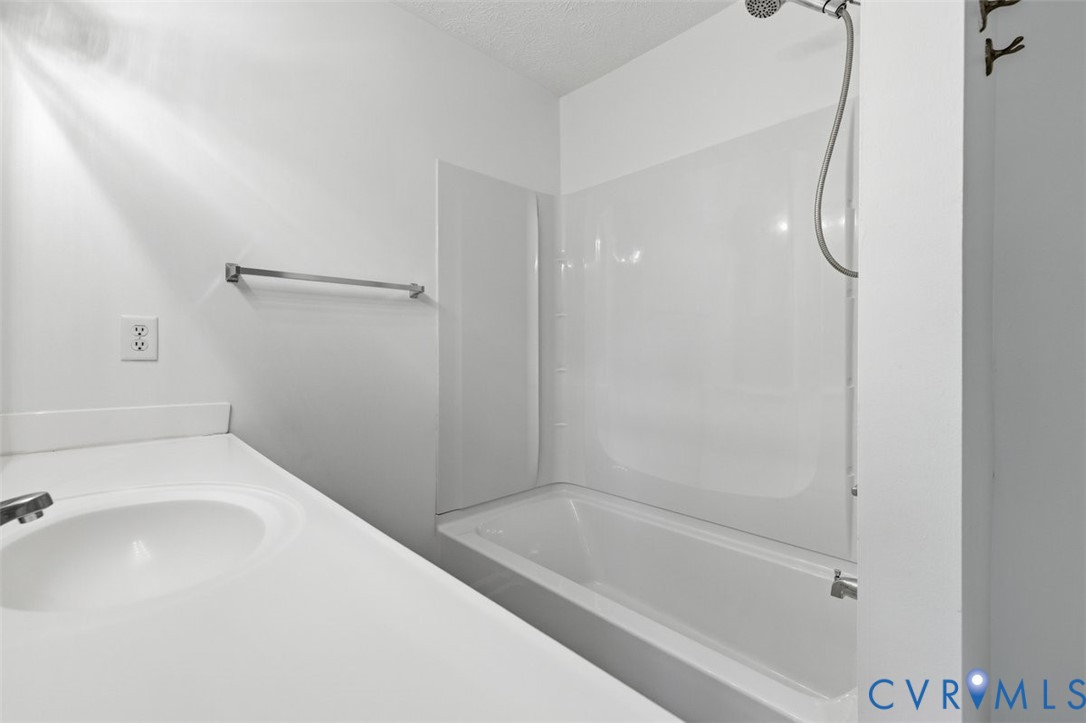 18501 Branders Bridge Road Colonial Heights, VA 23834 - Photo 23 of 43 a bathroom with a bath tub with a shower