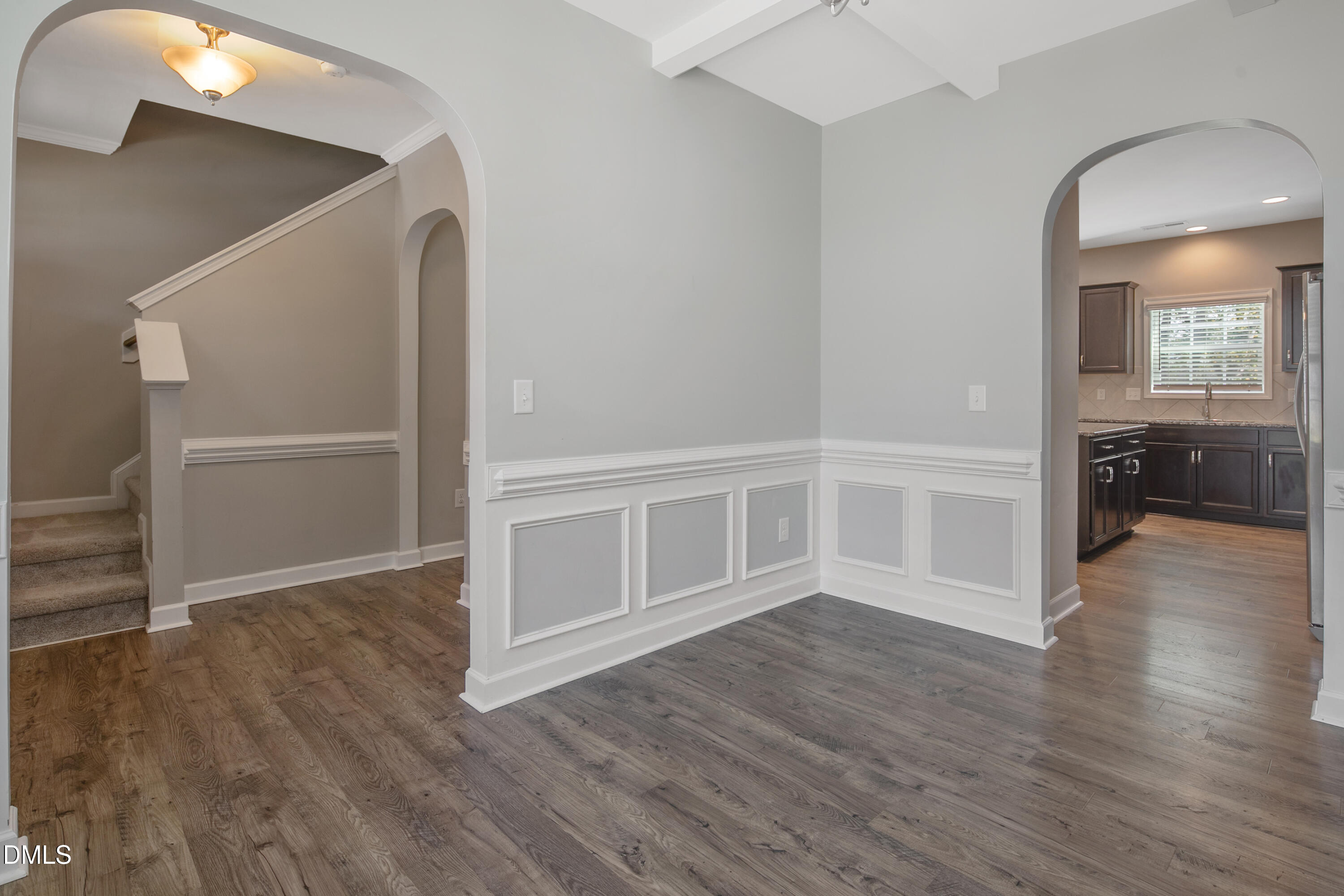 296 Birch Avenue Spring Lake, NC 28390 - Photo 10 of 37 a view of an empty room with wooden floor and a window