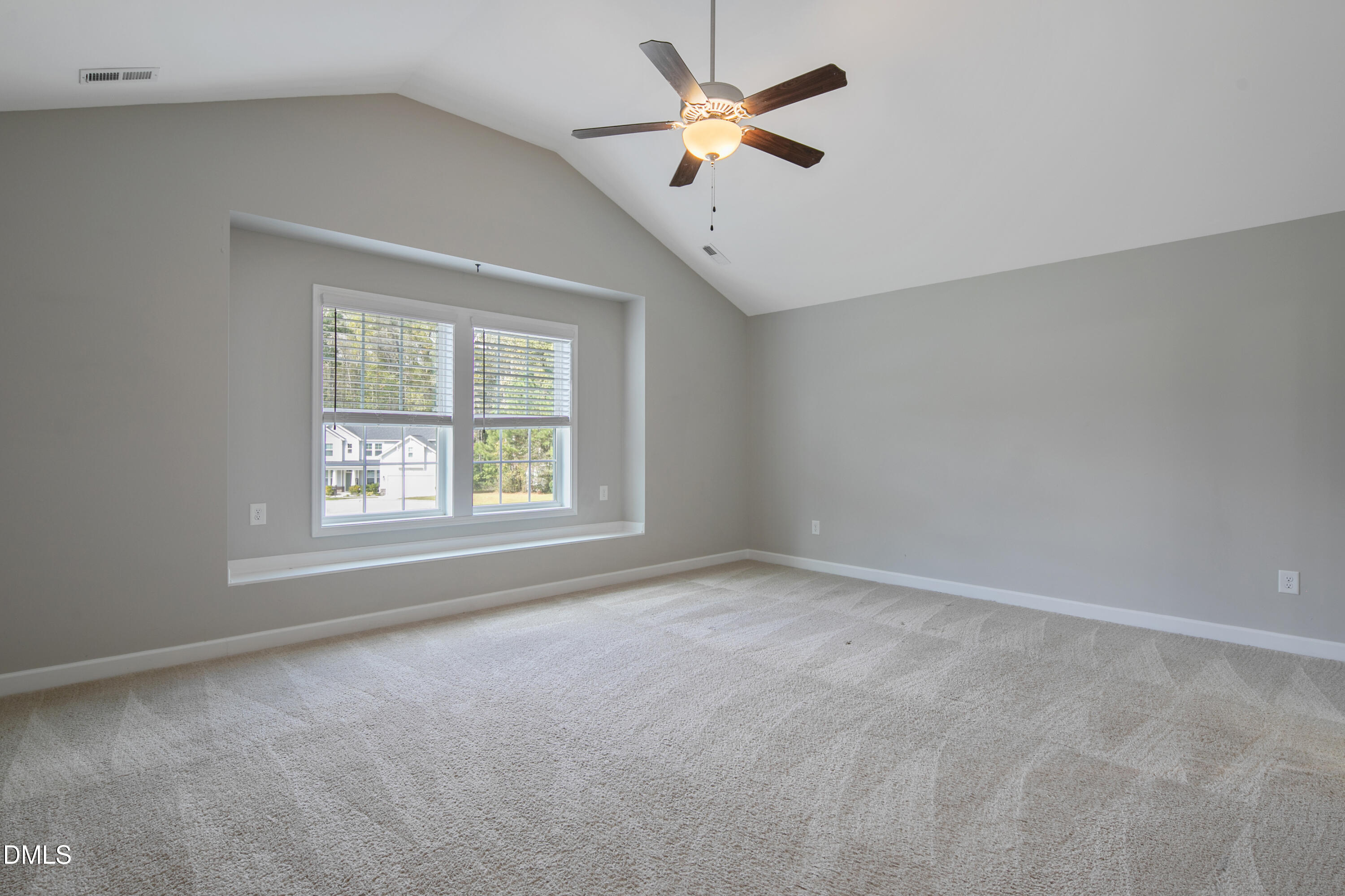 296 Birch Avenue Spring Lake, NC 28390 - Photo 19 of 37 an empty room with a window and a fan