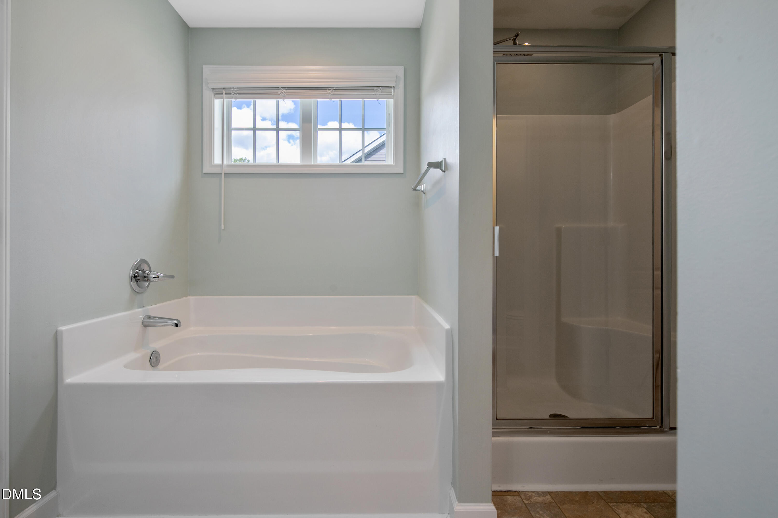 296 Birch Avenue Spring Lake, NC 28390 - Photo 22 of 37 a white bath tub sitting next to a window