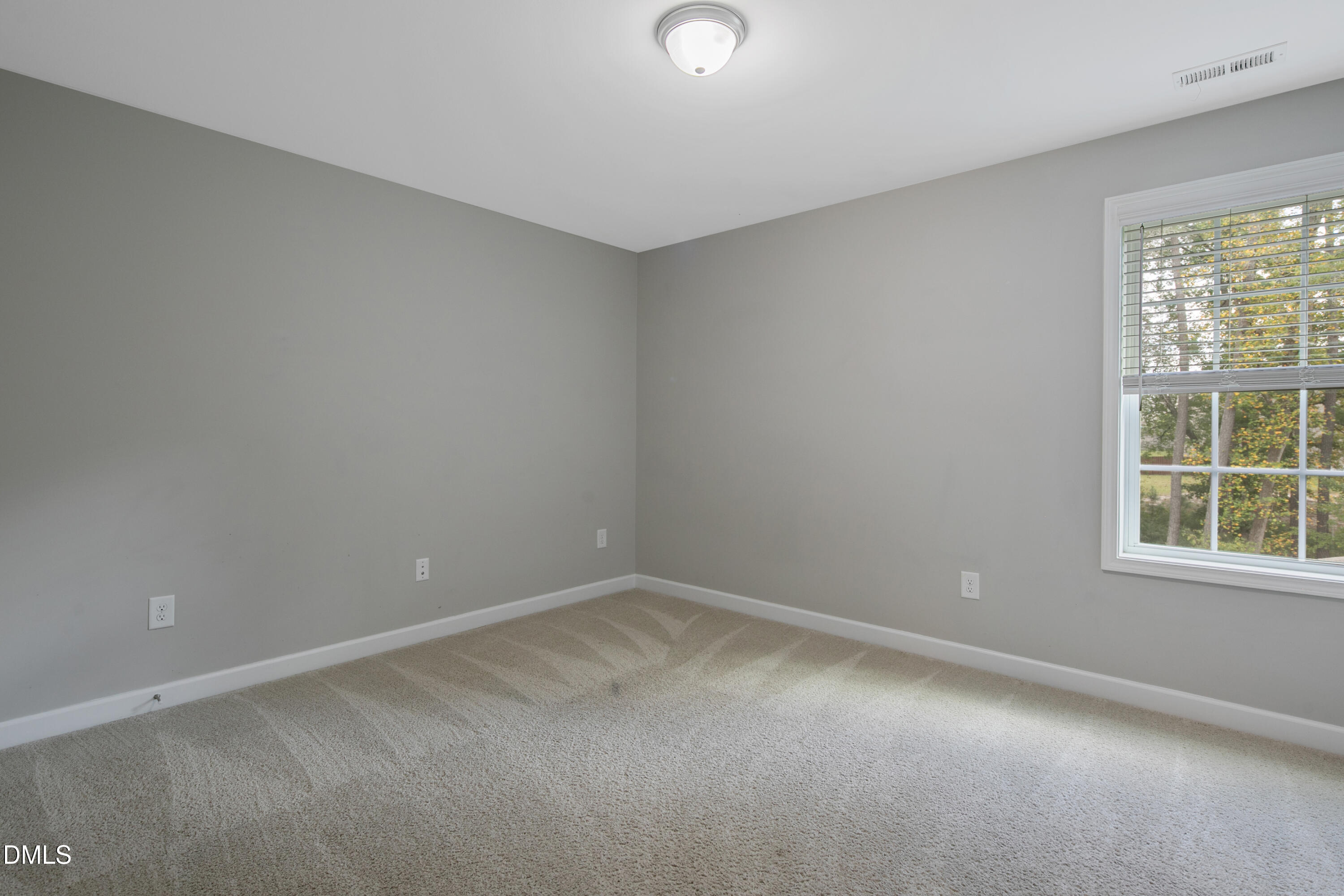 296 Birch Avenue Spring Lake, NC 28390 - Photo 23 of 37 an empty room with a window