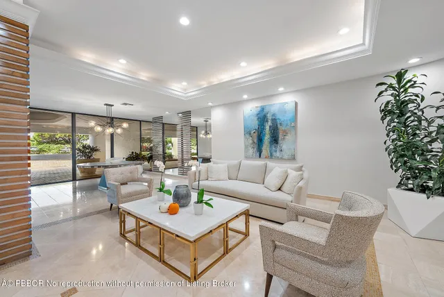 a dining room with furniture and garden view